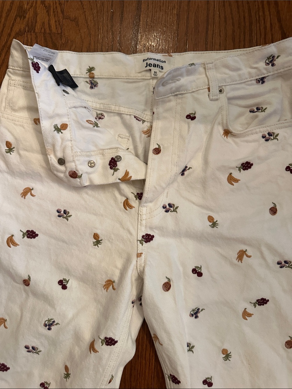 Reformation White High-Rise Jeans with Fruit Embroidery